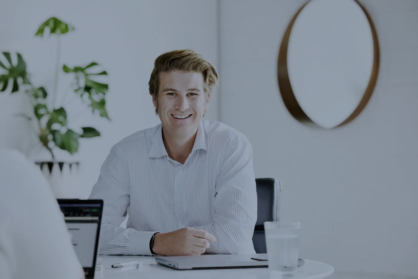Sebastian Fox at his desk, talking through a valuation